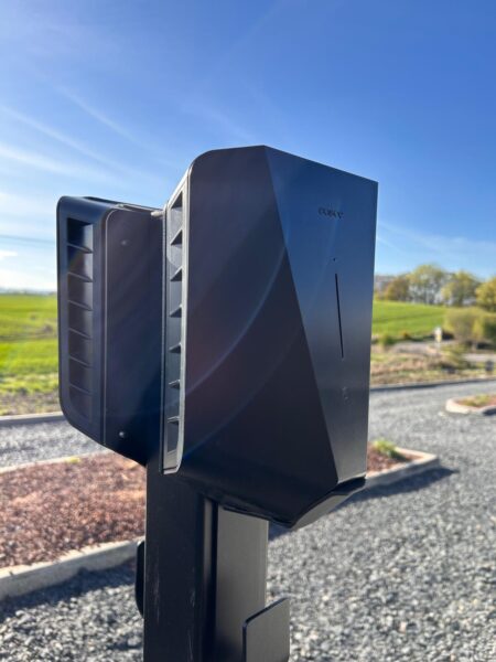Black ev chargers in car park