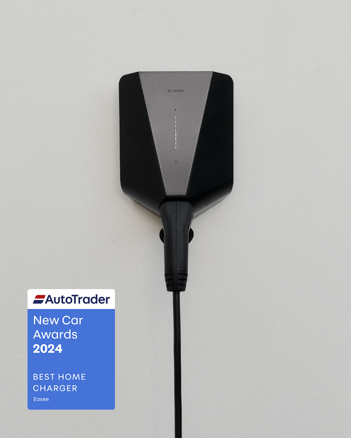 A black charger and a AutoTrader Best Home Charger 2024 award stamp