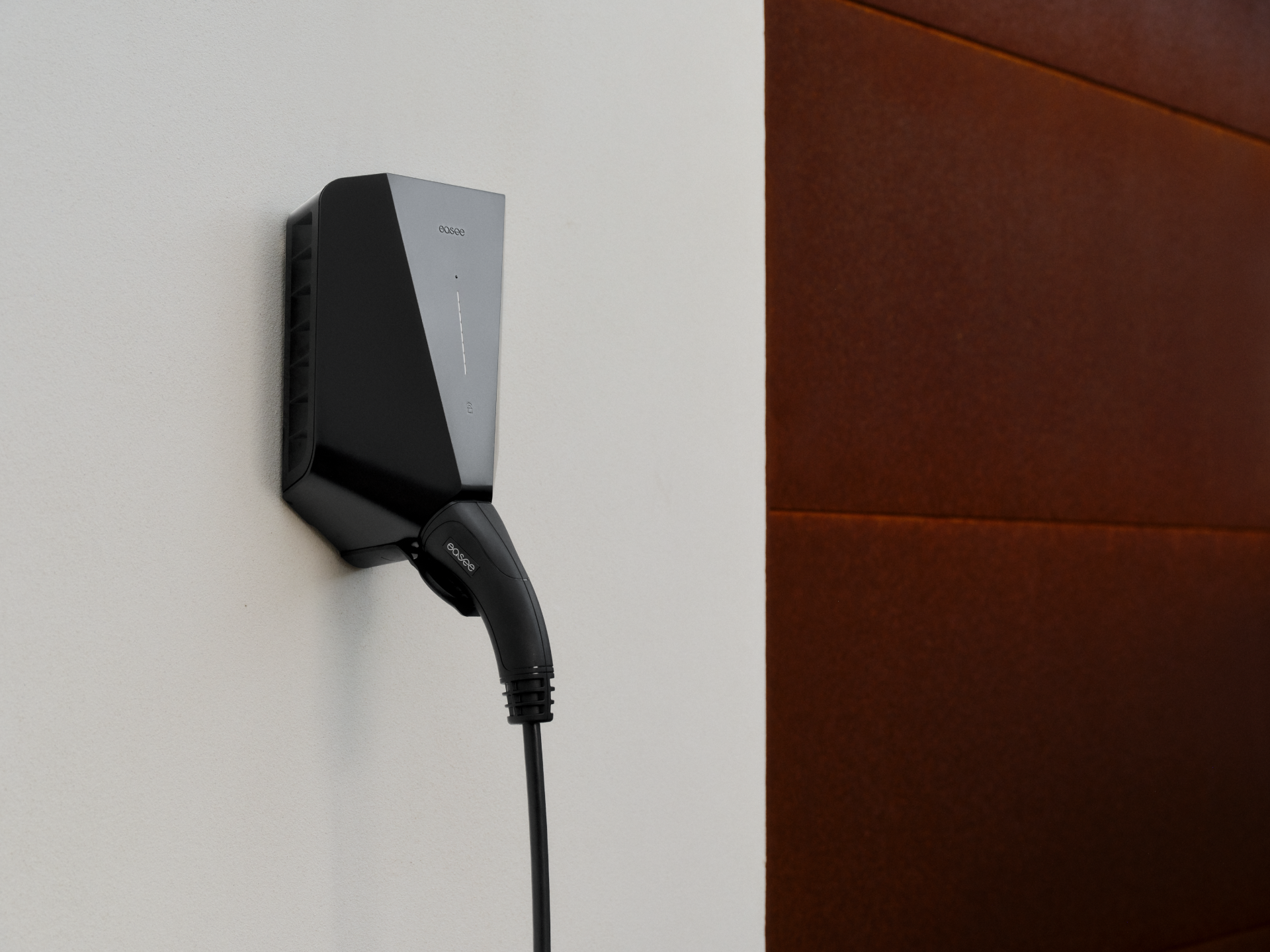 Easee charger mounted on a wall